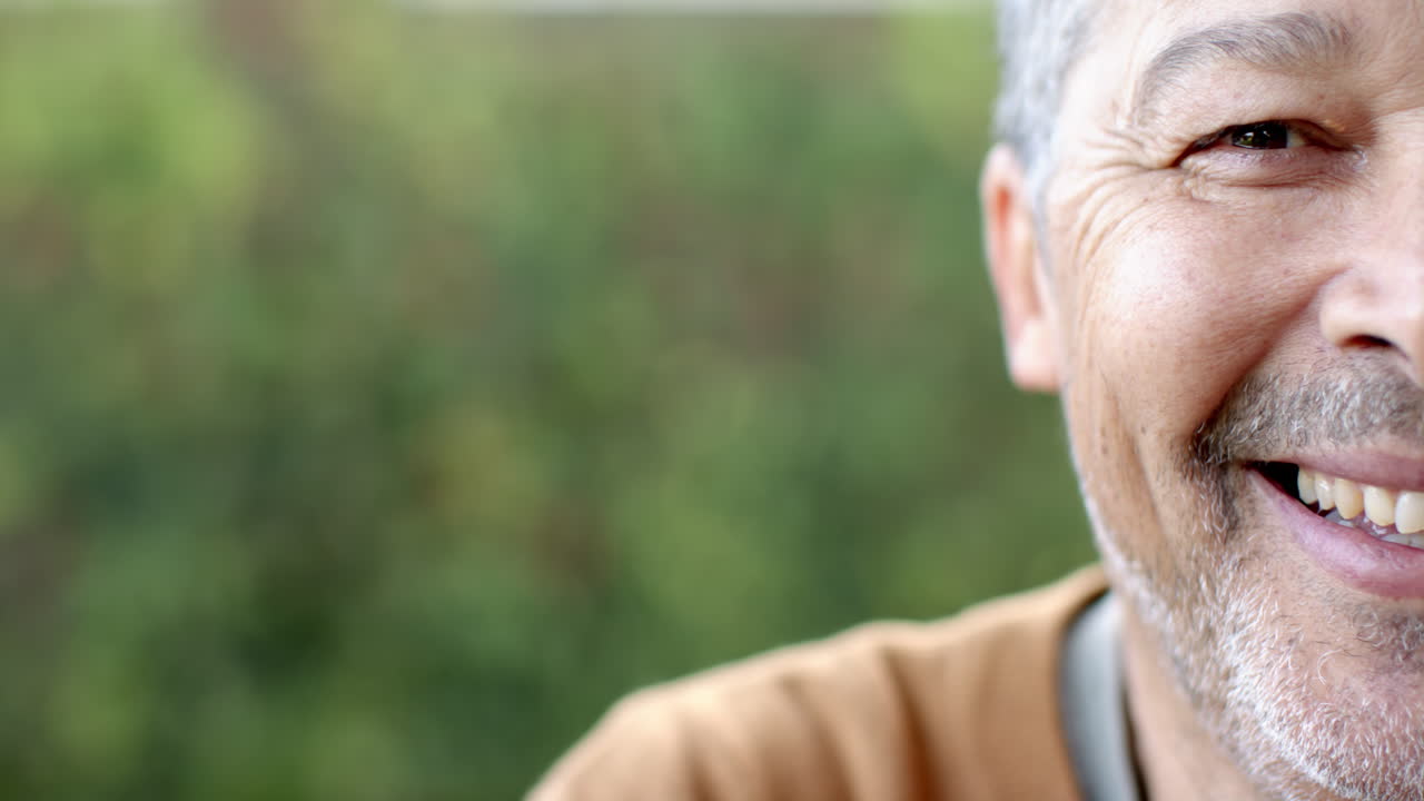 Enjoying nature and fresh air, smiling senior man outdoors, copy space
