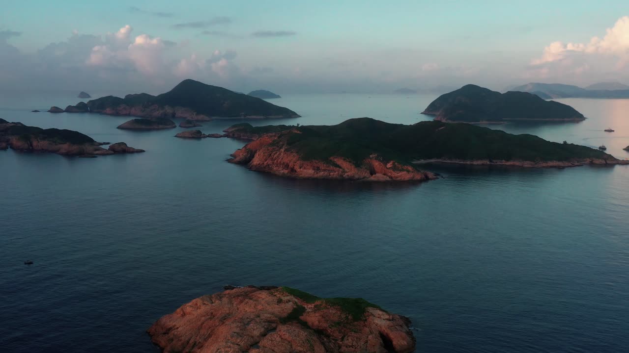 Aerial view of islands and coastline at Sai Kung National Park. Beautiful island sea view in Hong Kong. Aerial drone fly over small islands in Sai Kung, Hong Kong.