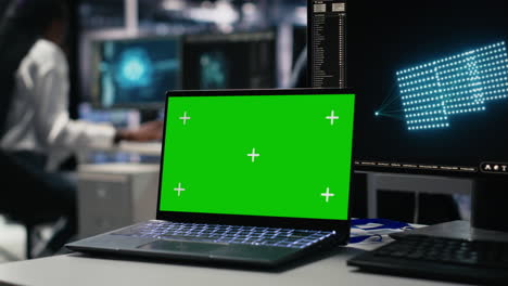 data center engineer working on neural network on chroma key laptop