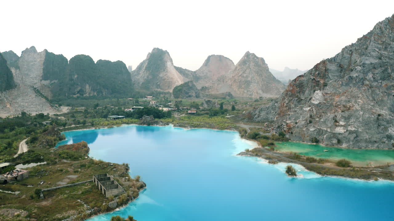 Stunning Aerial View of a Turquoise Lake Surrounded by Mountains in China