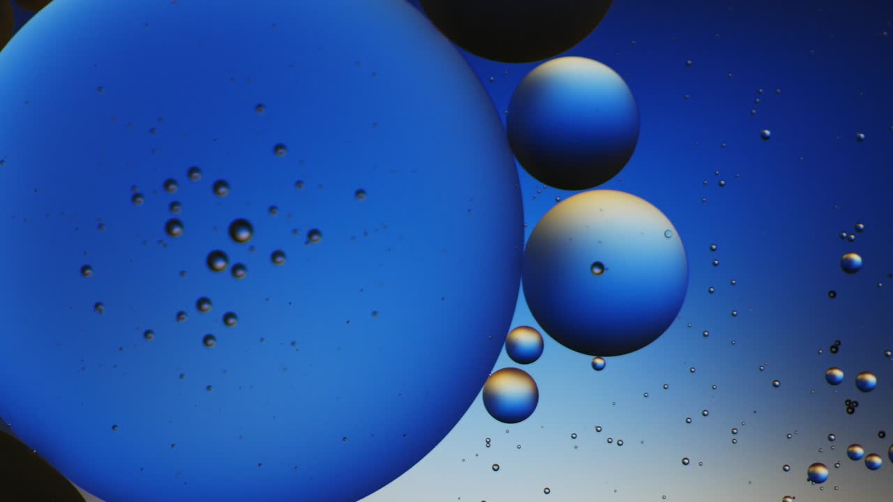 Colorful artistic of oil drop floating on the water.