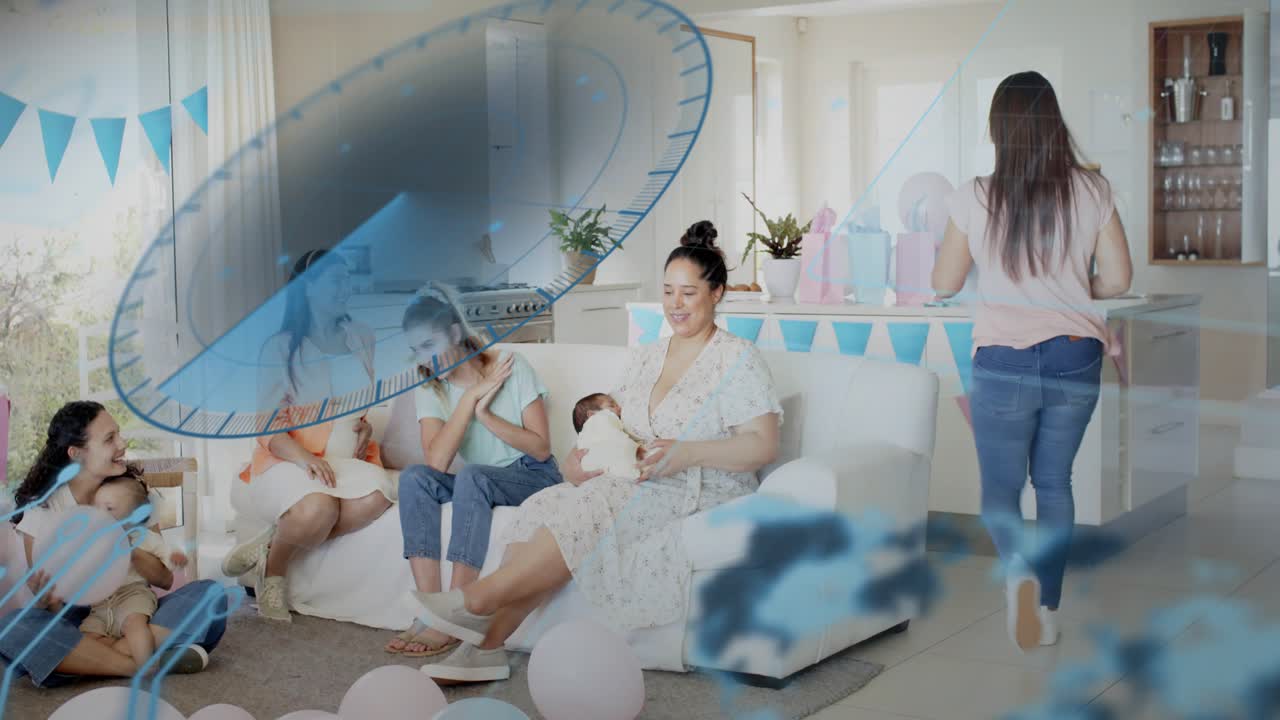 Host writing board, clapping, guests lifting balloon, showering mom holding baby under blue overlay