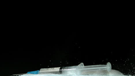 needle falling on pile of sugar
