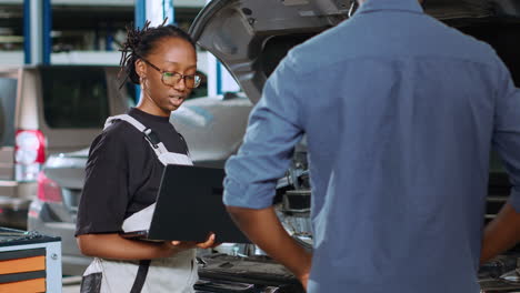 repairman calculates car fix services