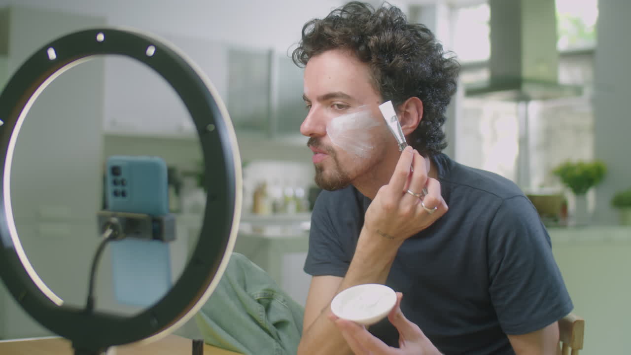 Beauty Blogger Applying Mask to Facial Skin