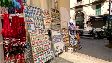 colorful souvenirs displayed in a naples street shop