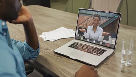 African-american-businessman-using-laptop-for-video-call-with-african-american-business-colleague