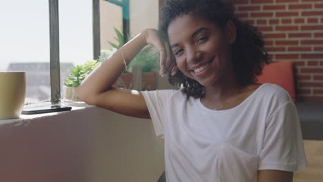 portrait confident african american woman smiling enjoying successful lifestyle happy female student relaxing at home in trendy apartment