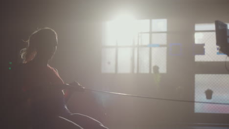 Woman Working Out on a Rowing Machine