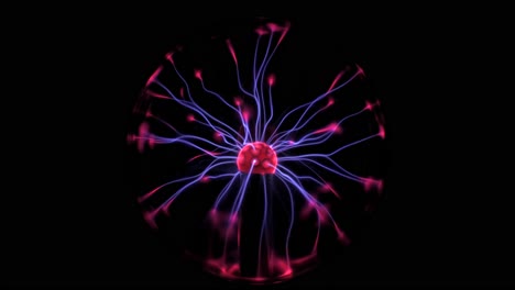 a plasma globe is seen electrifying with blue and red colors