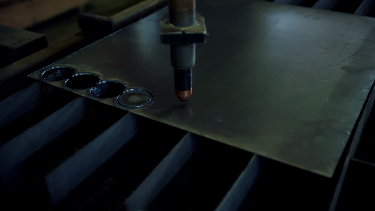 Industrial metalworking cutting. Cutting of metal, sparks flying from laser