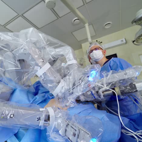 modern medical equipment in surgical room. robotic arms performing operation on a patient with minimally invasive intervention. innovative technologies in surgery
