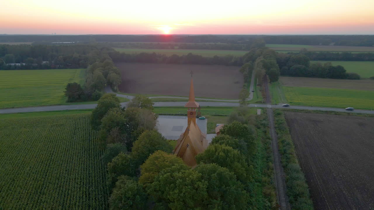 Parish Church At Sogel Town During Golden Sunset In Lower Saxony, Germany. aerial