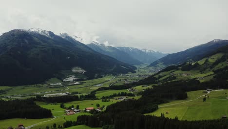 alpine valley with snow-capped peaks