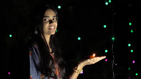 indian girl with diwali diya