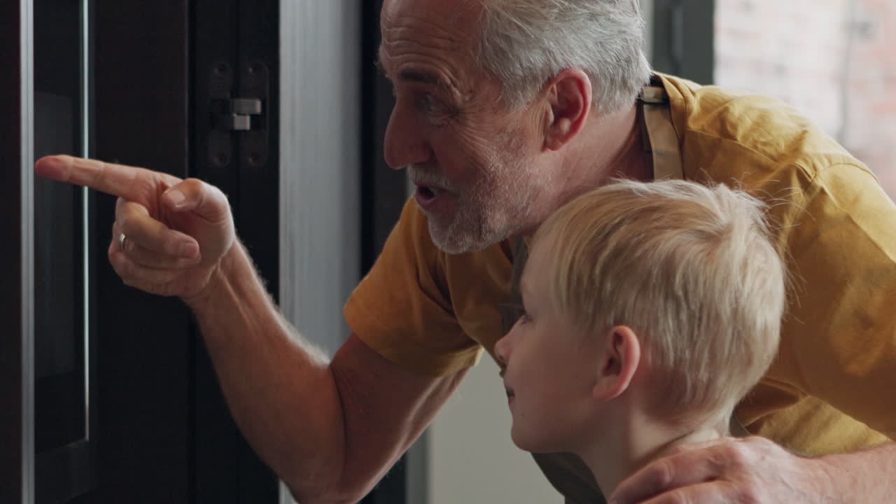 Grandfather and grandson cooking together