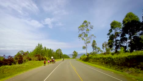 Time-Lapse-View-from-car's-top-of-green-valley-and-the-Rwenzori-Mountains-range-in-distance