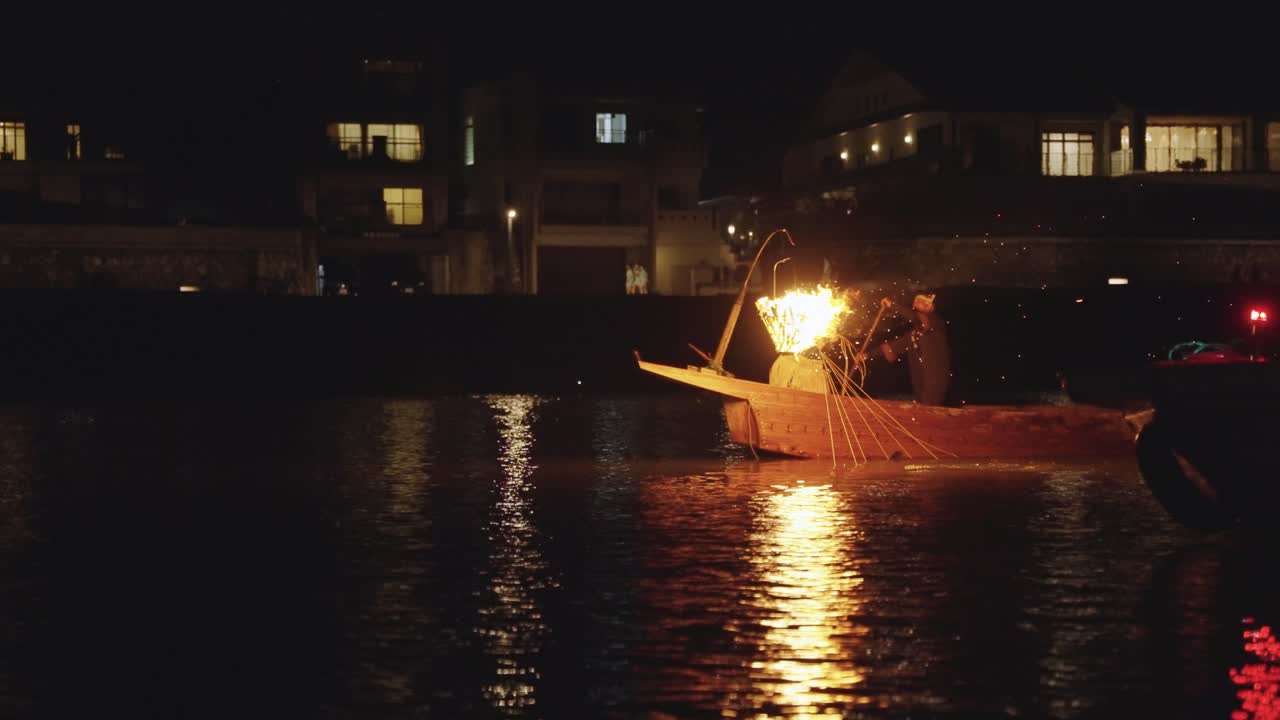 Traditional Japanese Fire Fishing at Night