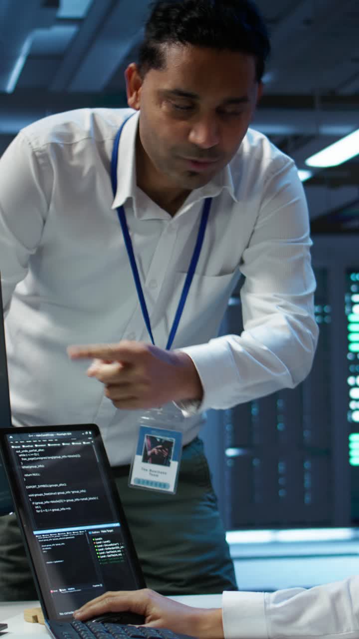 IT Professionals Collaborating on Software Development in Data Center