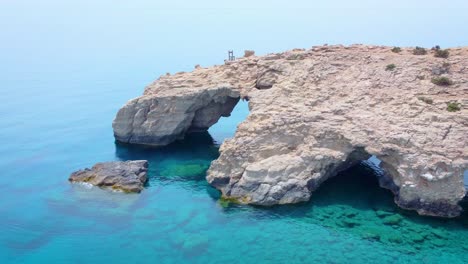 View-of-the-amazing-natural-bridge-on-beach-of-Tripiti-in-Gavdos-island