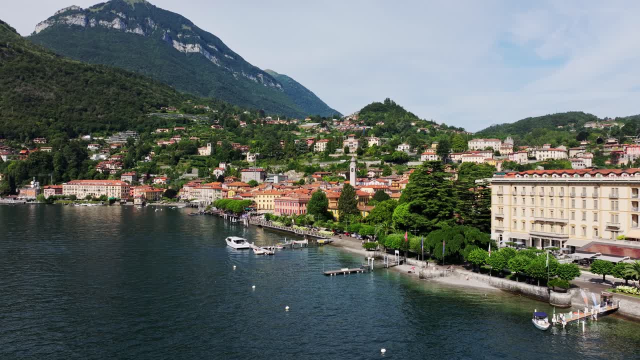 Idyllic lakeside town Menaggio on Lake Como with red rooftops and mountain views