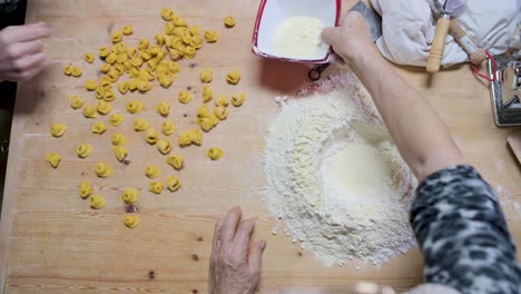 crop woman preparing dough at table in kitchen