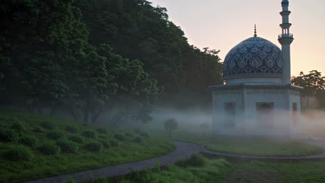 misty mosque in a park at sunrise/sunset