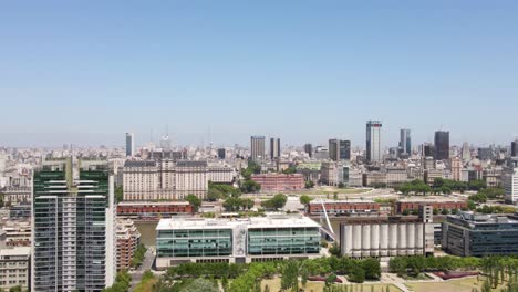 aerial parallax shot of puerto madero waterfront and buenos aires government buildings