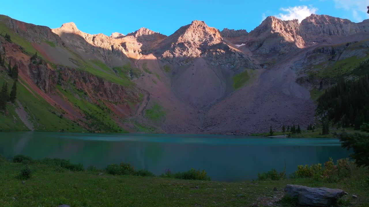 Sunset hiking trail wildflowers Lower Blue Lakes wildflowers Mount Sneffels Wilderness summer Ridgway Telluride Colorado Rocky Mountains Uncompahgre National Forest San Juan Dallas Range right pan up