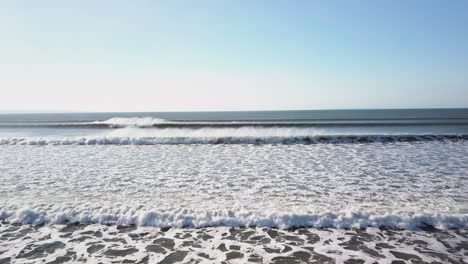 Calm-And-Relaxing-View-Of-The-Waves-Crashing-Unto-The-Beach-At-Saunton-Sands-England---wide-shot