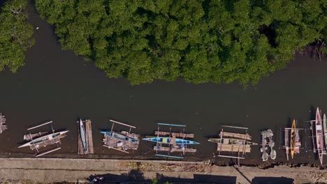 top down perspective aerial of fishermans boats moored along the shoreline balibayon, surigao city, philippines