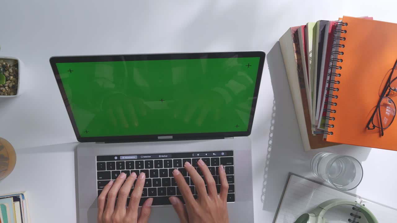 Person Working on Laptop at a Desk