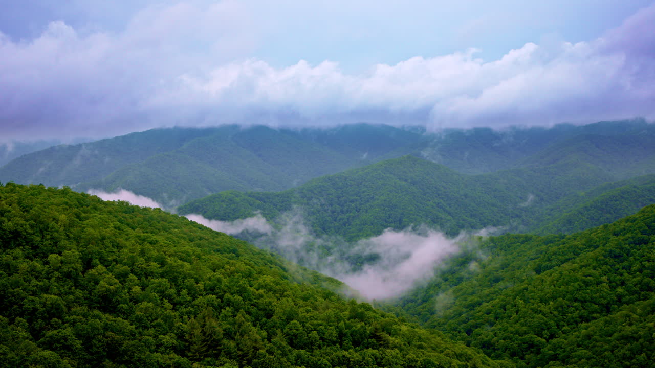 Drone flies above the Smoky Mountains lost in dreamy haze