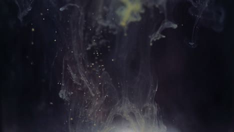 colored paint floating in darkish water tank. stable shot with the sony a7iii