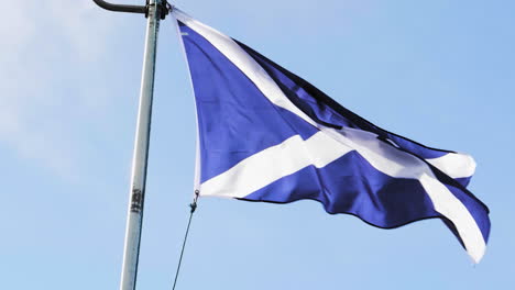 national flag of scotland in the wind