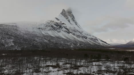 aerial drone pulls back, otertinden mountain, signaldalen, signal valley, norway