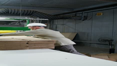 factory worker handling cardboard boxes