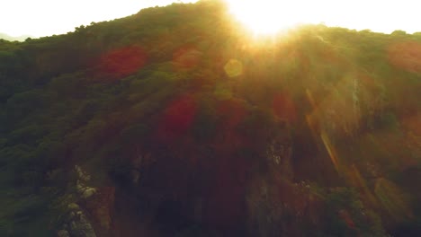 Drone-shot-with-panning-shot-showing-shifting-solar-flare-with-a-city-in-back-drop