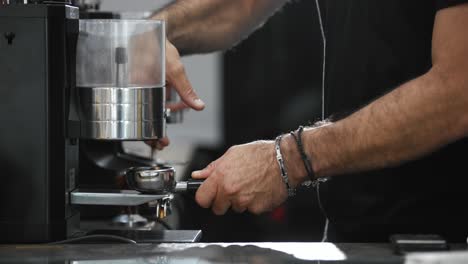 barista preparing the espresso lever to make coffee