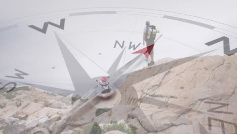 caucasian senior man hiking in countryside standing on cliff edge, over turning compass