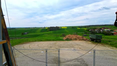 rapeseed fields from pumpjack mining oil in the oil field during daytime