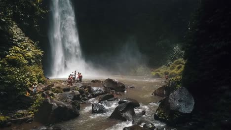 Bali,-Spring-2020-in-1080-60p,-Daytime,-cinematic-drone-flight-A-slow-motion-horizontally-from-left-to-right-flight-in-front-of-a-Waterfall