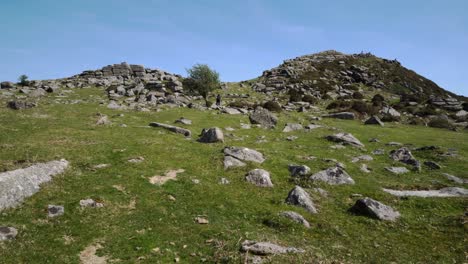 dartmoor, the granite mounds of sharp tor on a very hot day in spring