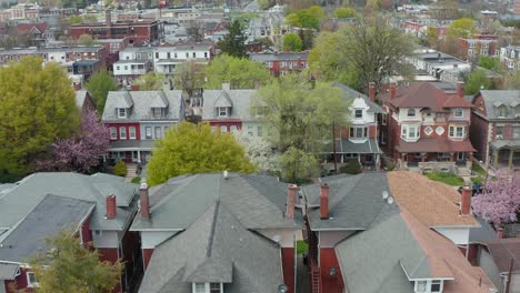 Aerial-dolly-forward-features-rows-of-homes-in-urban-city-setting-in-USA