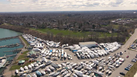 Sailing-Yachts-Leisure-Boats-Off-Water-on-Storage-Area,-Nautical-Parking-at-Port-Dalhousie-Harbor-Marina-Pier-Jetty,-Dock-Quay-Coastal-Waterfront-off-Season-Landscape,-Aerial-View