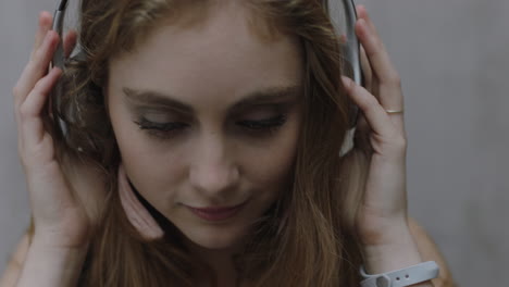 close up portrait beautiful young woman listening to music wearing headphones relaxing enjoying carefree lifestyle