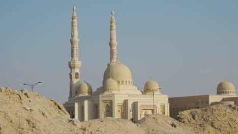 Peak-Through-Al-Qasimiya-Mosque-At-Sharjah-City---panning-medium-shot