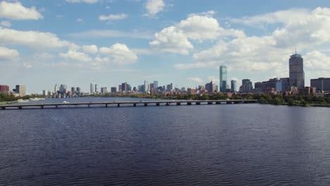 aerial cloudy boston city skyline with harvard bridge and skyscrapers