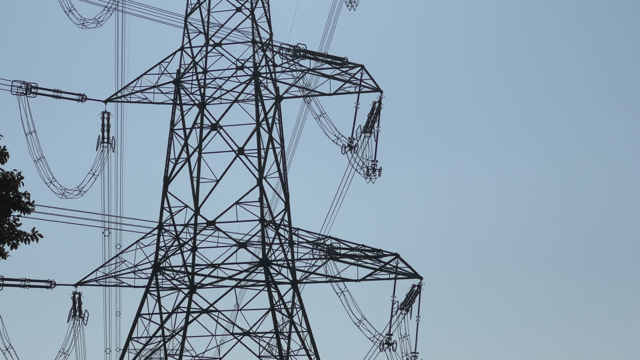 low angle shot of high voltage electric transmission tower
