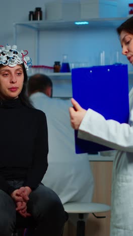 woman undergoing eeg brain scan in a laboratory setting